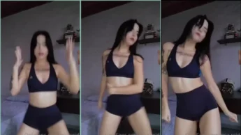 Mia Reid de shortinho e top dançando