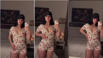 Talita Ravier de roupa sexy na frente do espelho