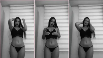 Laura Natali de calcinha e top se exibindo sensualmente