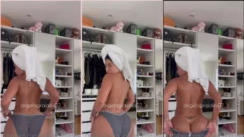 Angela Grajales de toalha e calcinha grande exibindo rabão