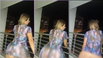 Alejandra bunduda loira de vestido dançando na varanda